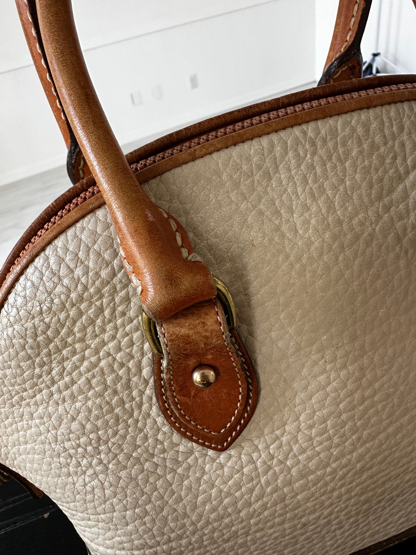 90s Dooney and Bourke Norfolk satchel in cream