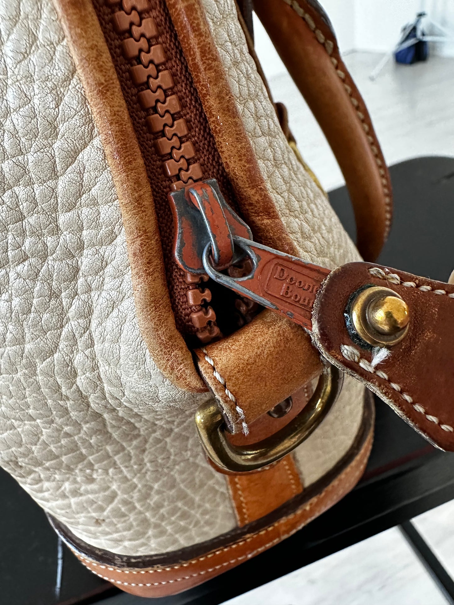 90s Dooney and Bourke Norfolk satchel in cream