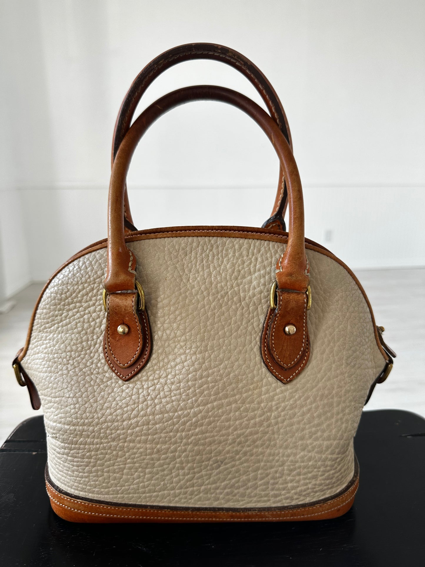 90s Dooney and Bourke Norfolk satchel in cream