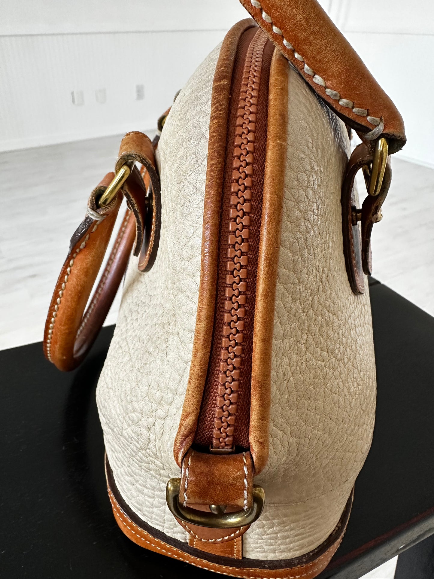 90s Dooney and Bourke Norfolk satchel in cream