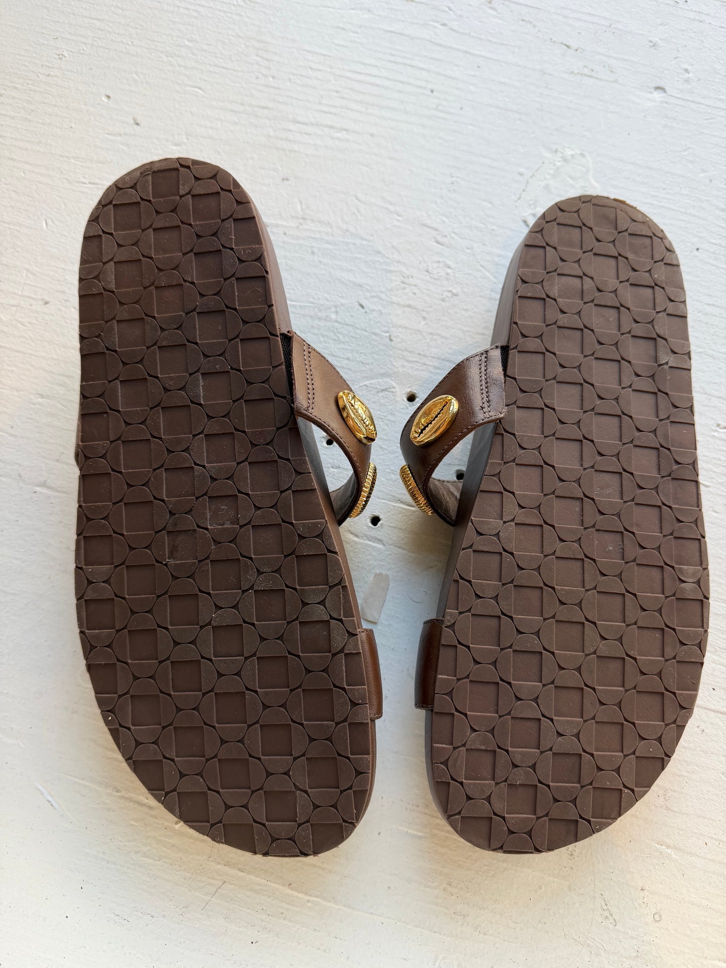 Larroude Madison Slide Sandals in brown leather, featuring gold-toned starfish and seashell hardware. Size 9