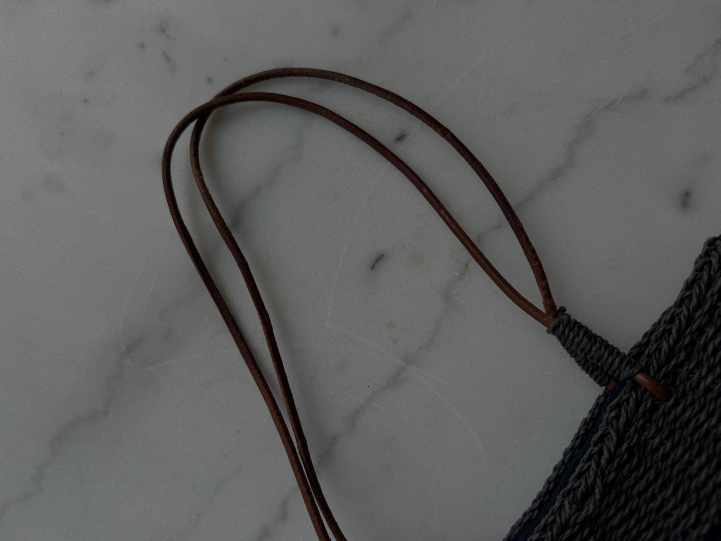 Vintage navy woven bag with wooden buttons and leather straps. Made in France