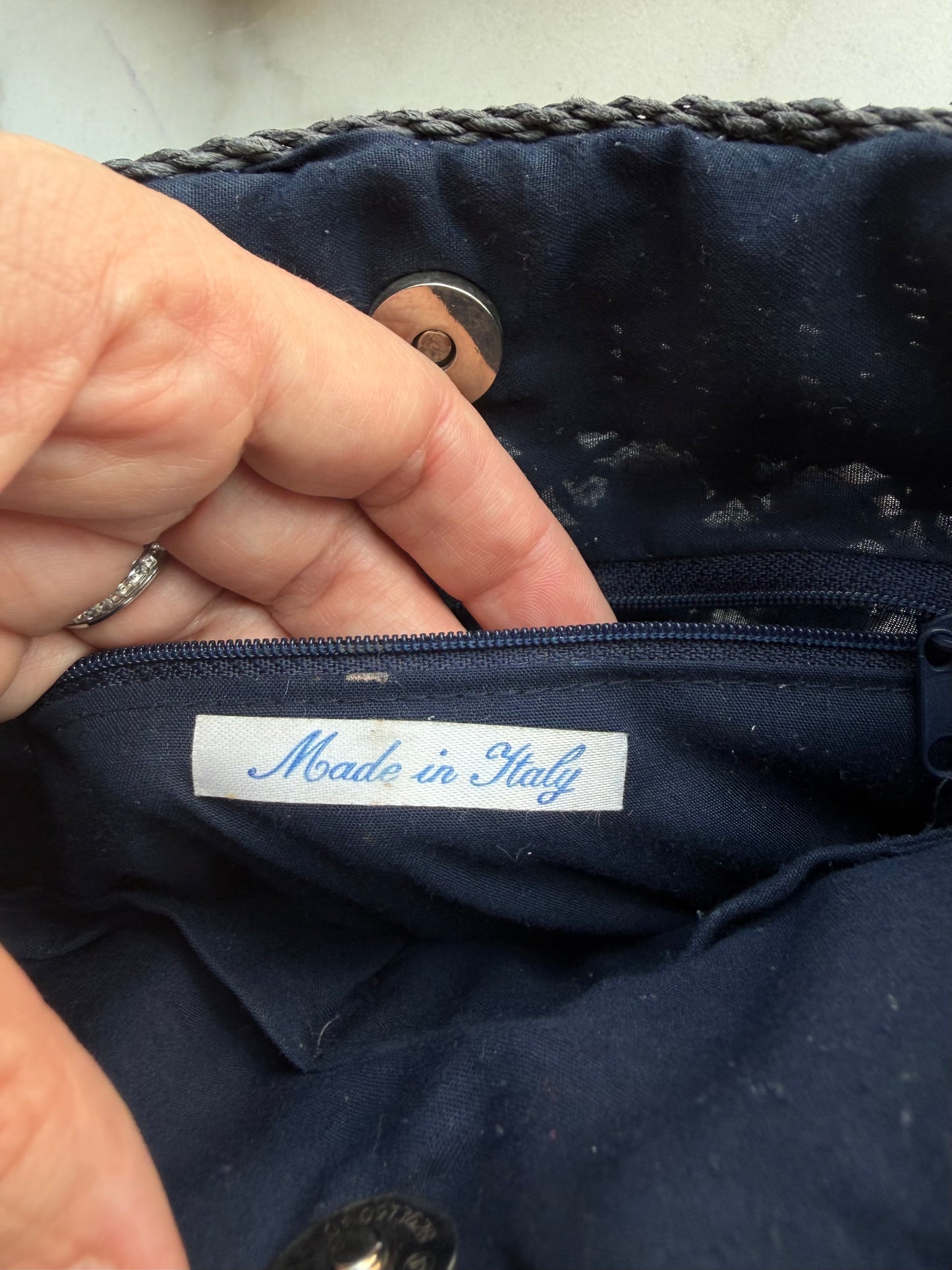 Vintage navy woven bag with wooden buttons and leather straps. Made in France