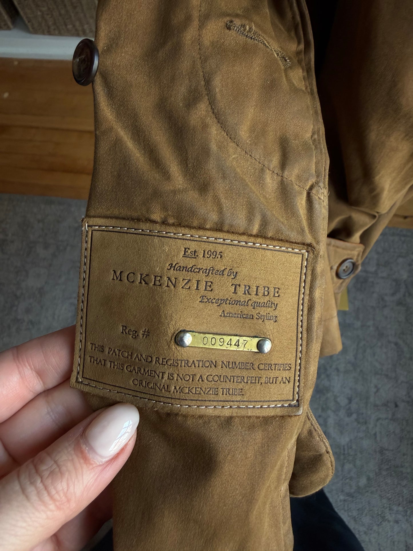 90s McKenzie Tribe waxed cotton jacket with leather collar and button out wool liner. Made in the USA. Fits M-XL