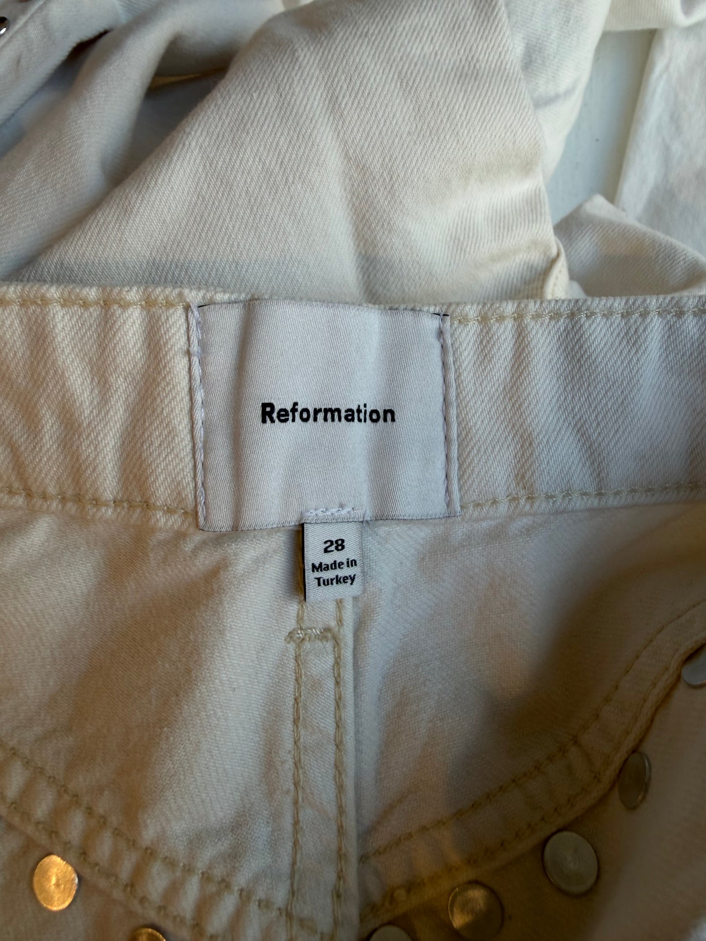 Reformation Carly studded jeans in cream. Size 28