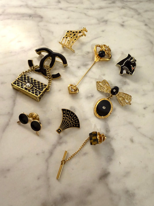 Gold and black brooch pack
