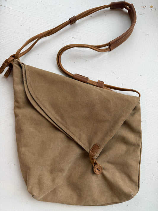 Crossbody canvas satchel with leather strap and closure