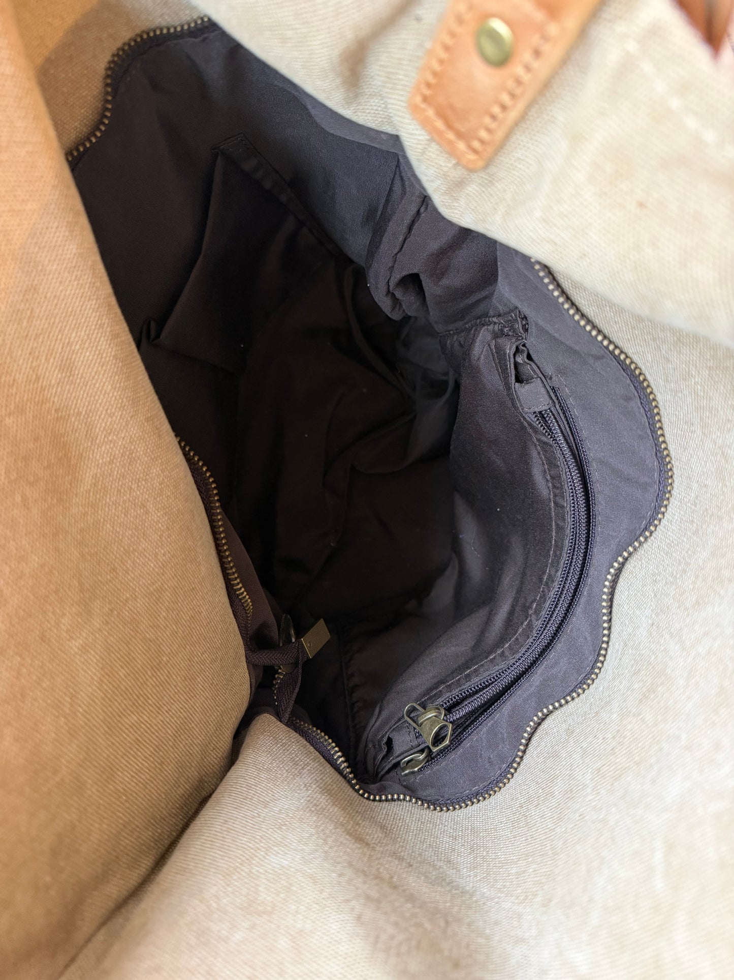 Crossbody canvas satchel with leather strap and closure