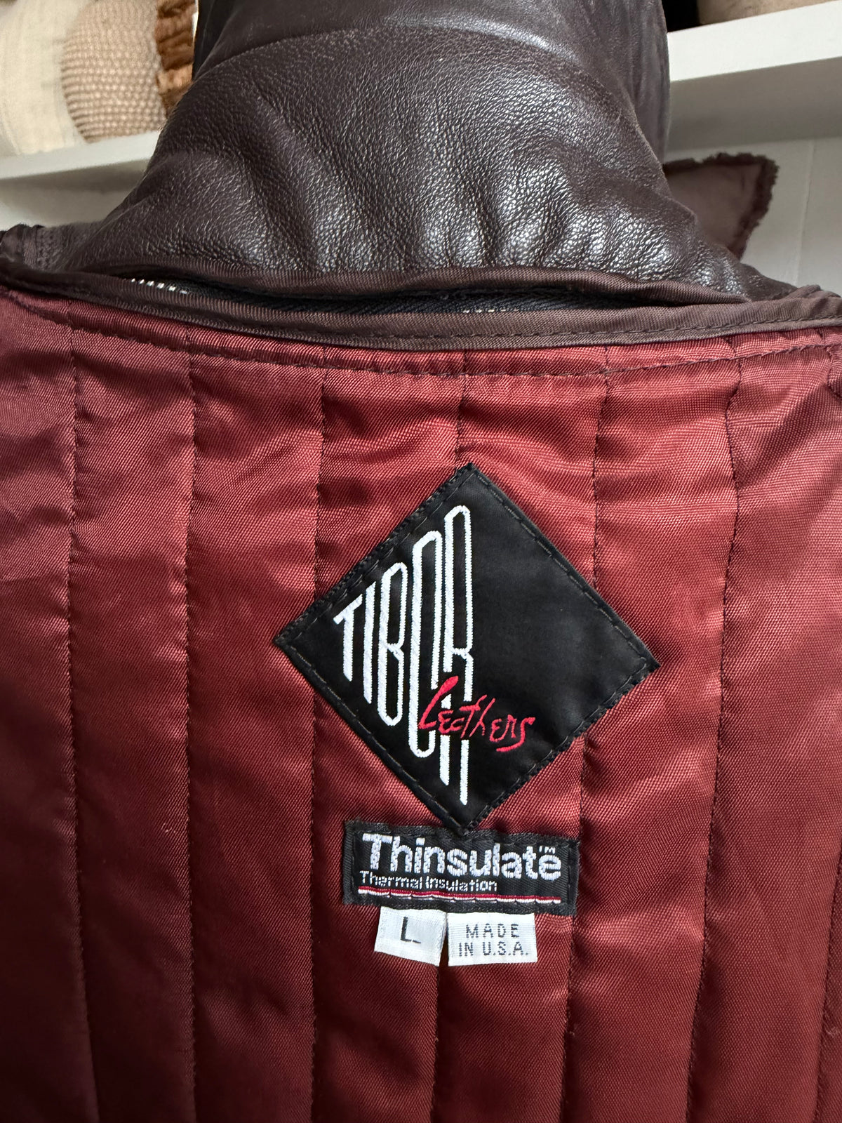 80s Tibor leather trench with zip out insulation and a zip off leather hood with real fur trim. Made in the USA. Fits S-L