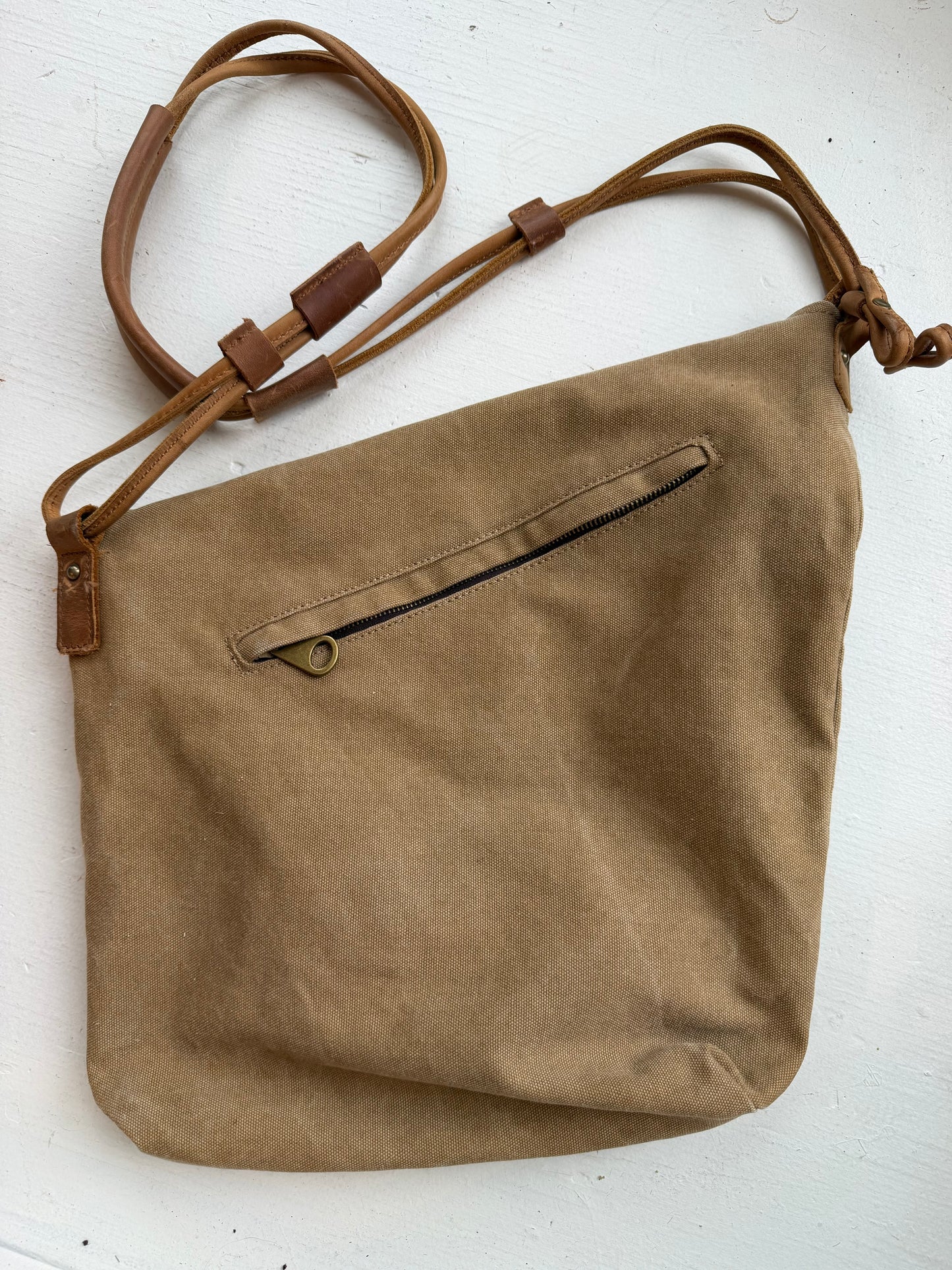 Crossbody canvas satchel with leather strap and closure