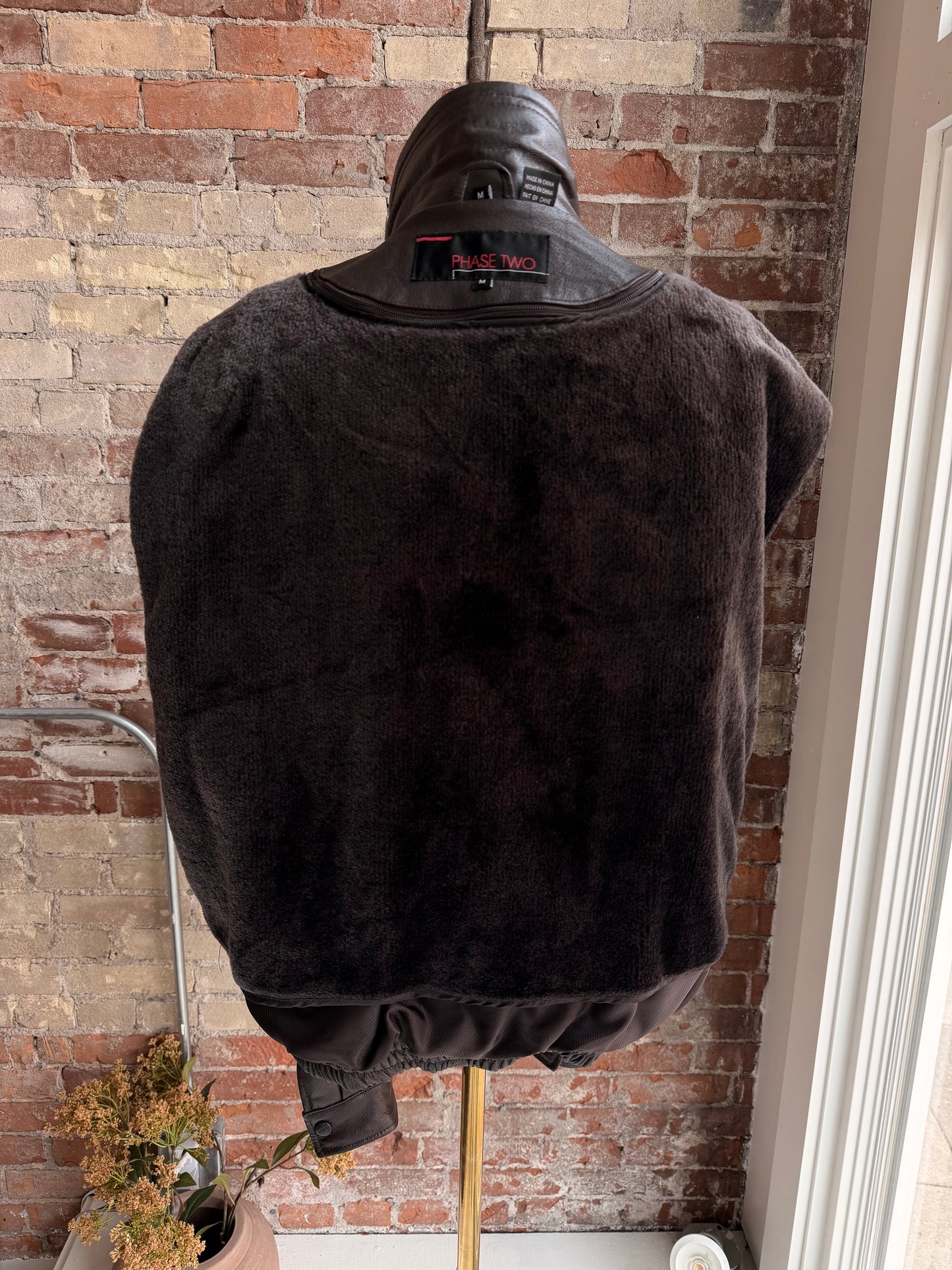 90s Phase Two leather bomber with zip out faux fur lining.