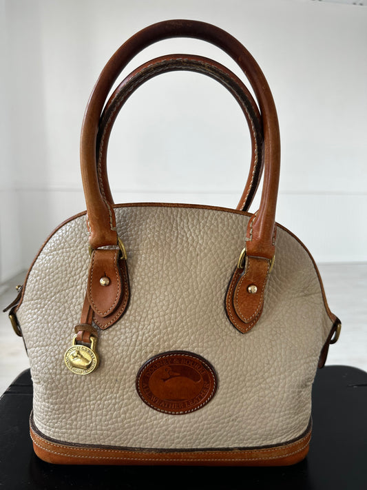 90s Dooney and Bourke Norfolk satchel in cream
