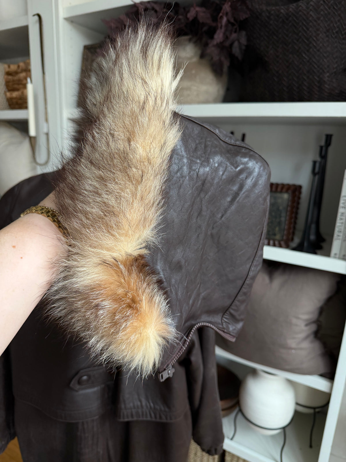 80s Tibor leather trench with zip out insulation and a zip off leather hood with real fur trim. Made in the USA. Fits S-L