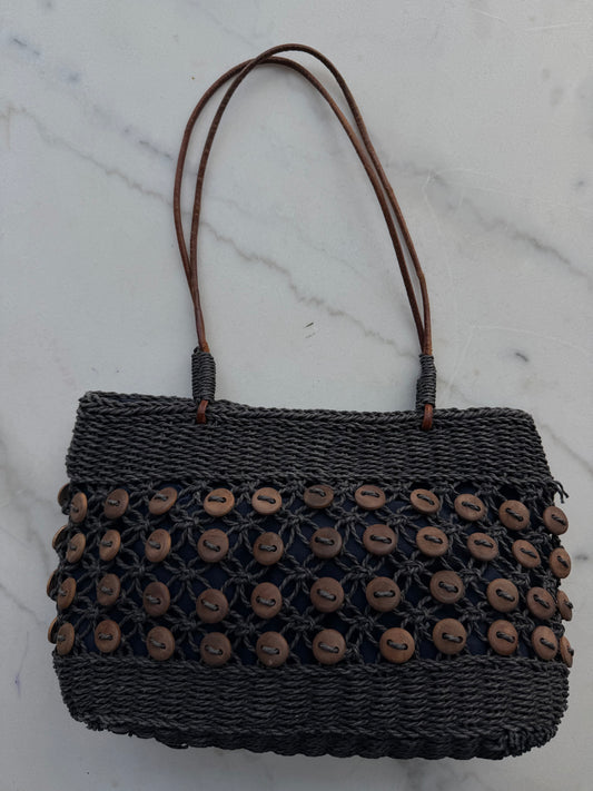 Vintage navy woven bag with wooden buttons and leather straps. Made in France