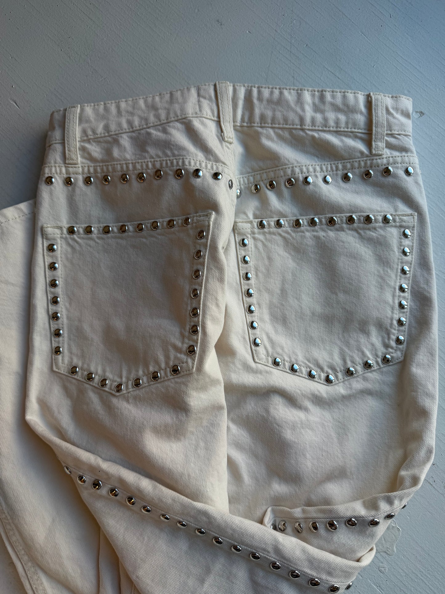 Reformation Carly studded jeans in cream. Size 28