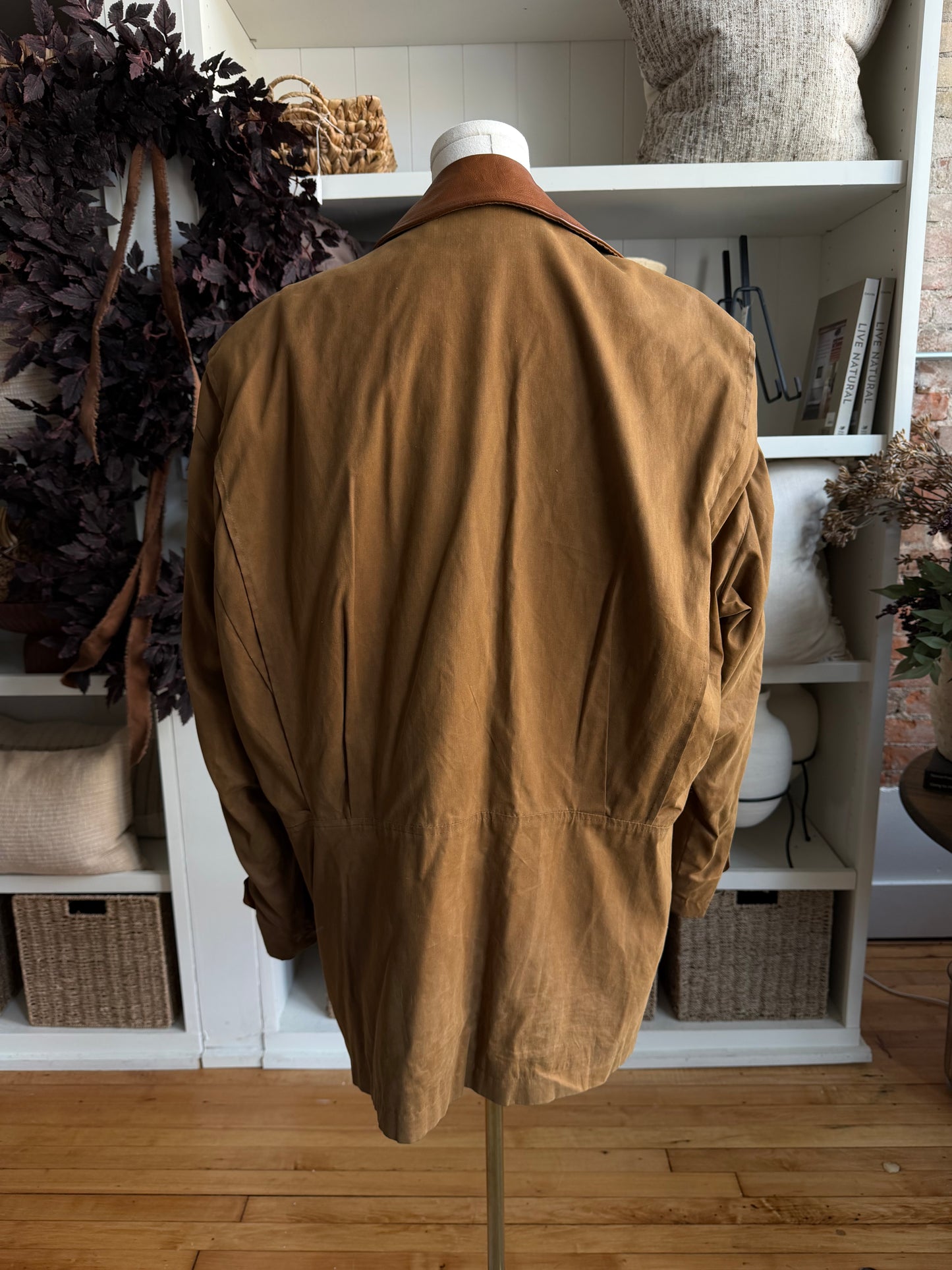 90s McKenzie Tribe waxed cotton jacket with leather collar and button out wool liner. Made in the USA. Fits M-XL