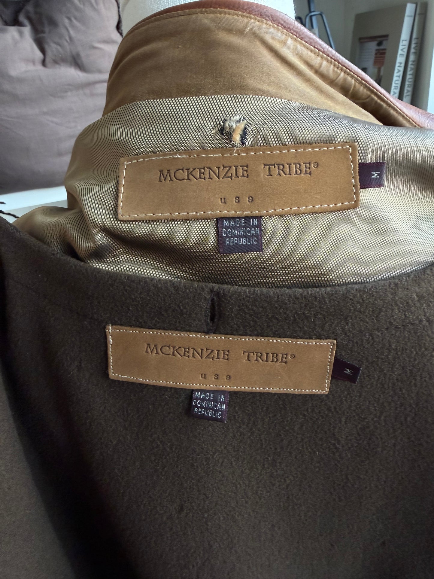 90s McKenzie Tribe waxed cotton jacket with leather collar and button out wool liner. Made in the USA. Fits M-XL