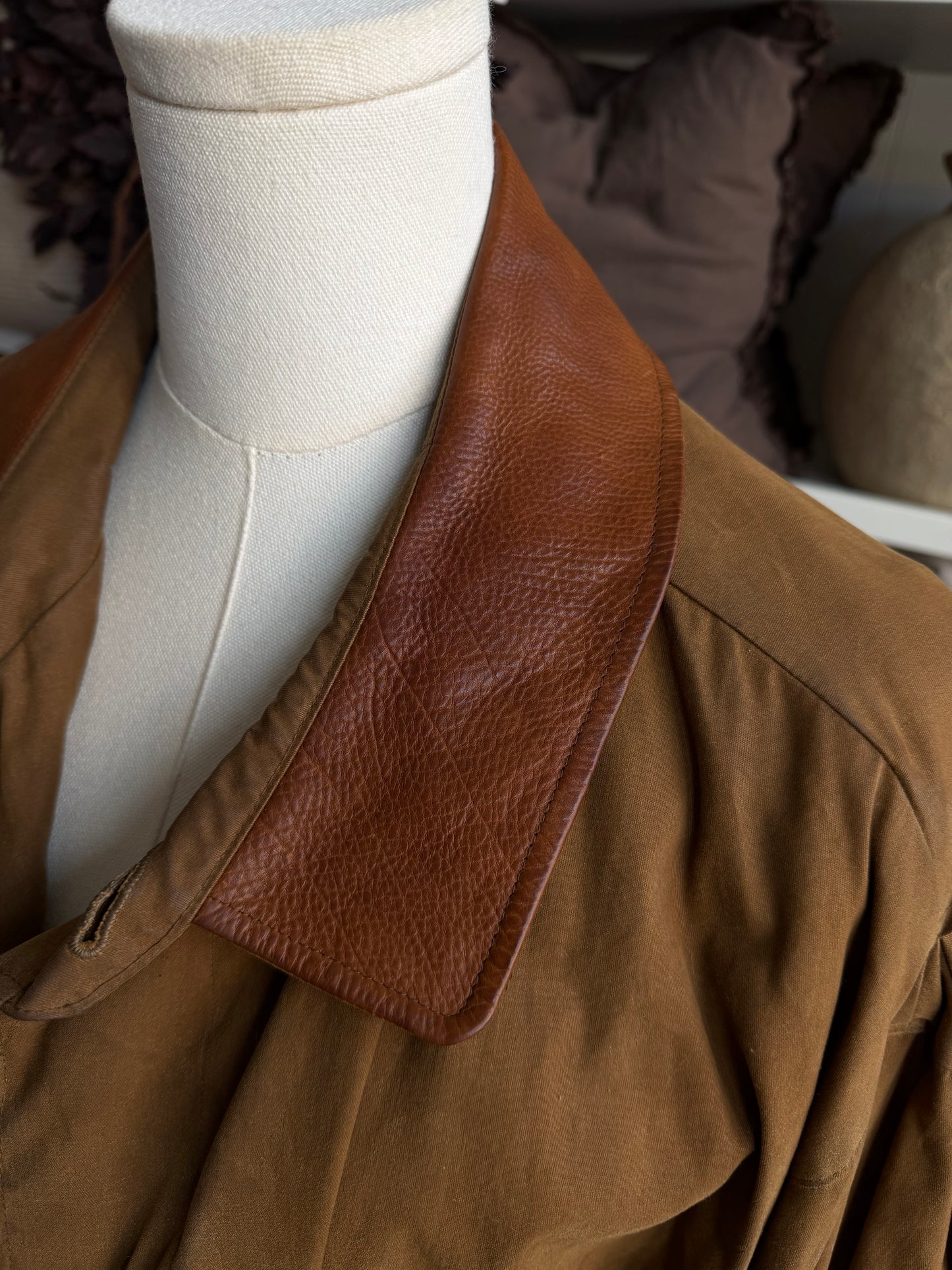 90s McKenzie Tribe waxed cotton jacket with leather collar and button out wool liner. Made in the USA. Fits M-XL