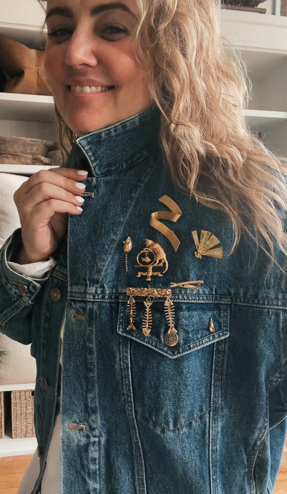Vintage Calvin Klein denim jacket with collected brooches