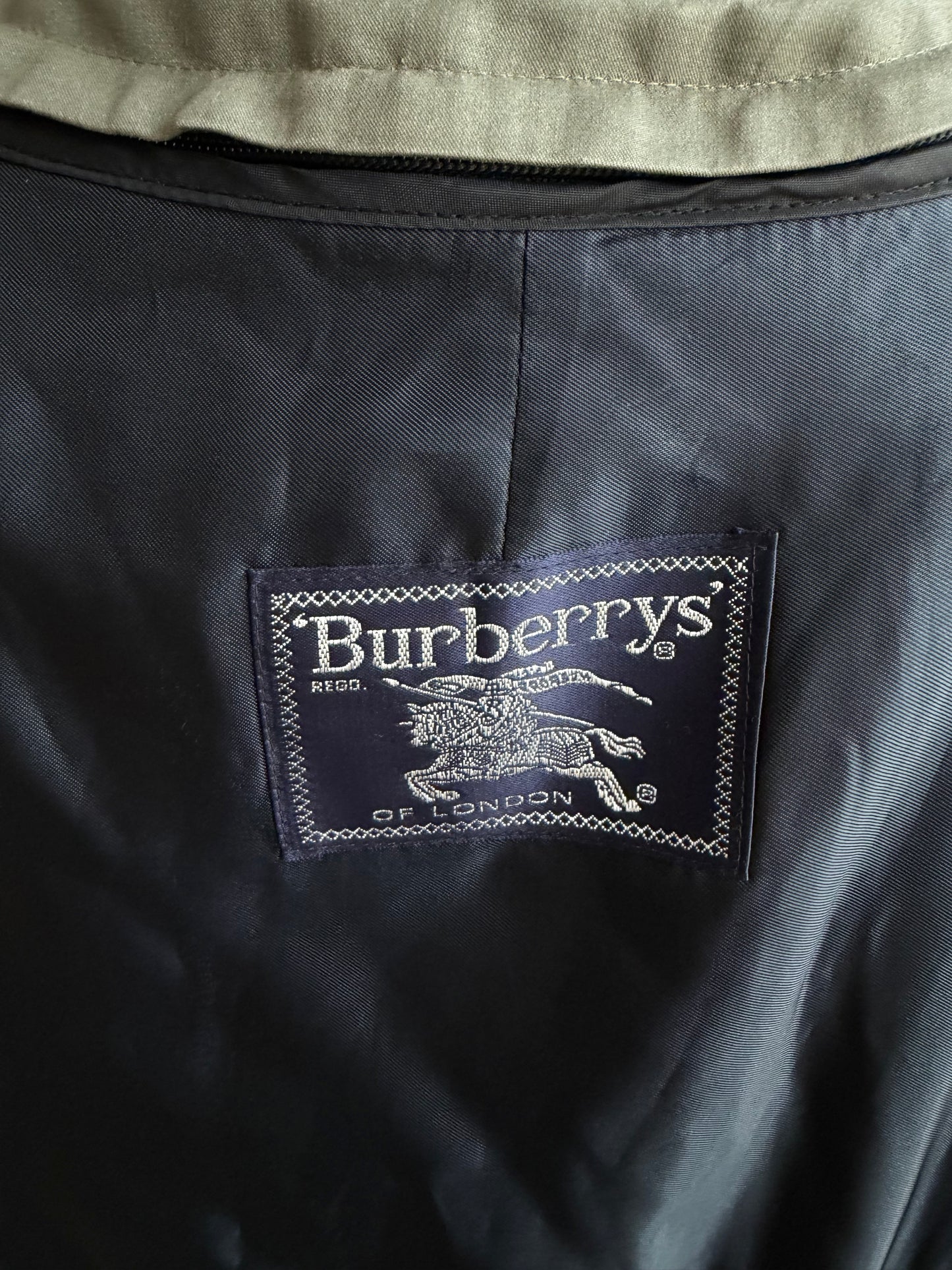 Vintage Burberry green trench with navy wool zip out lining and button off collar. Fits S-L