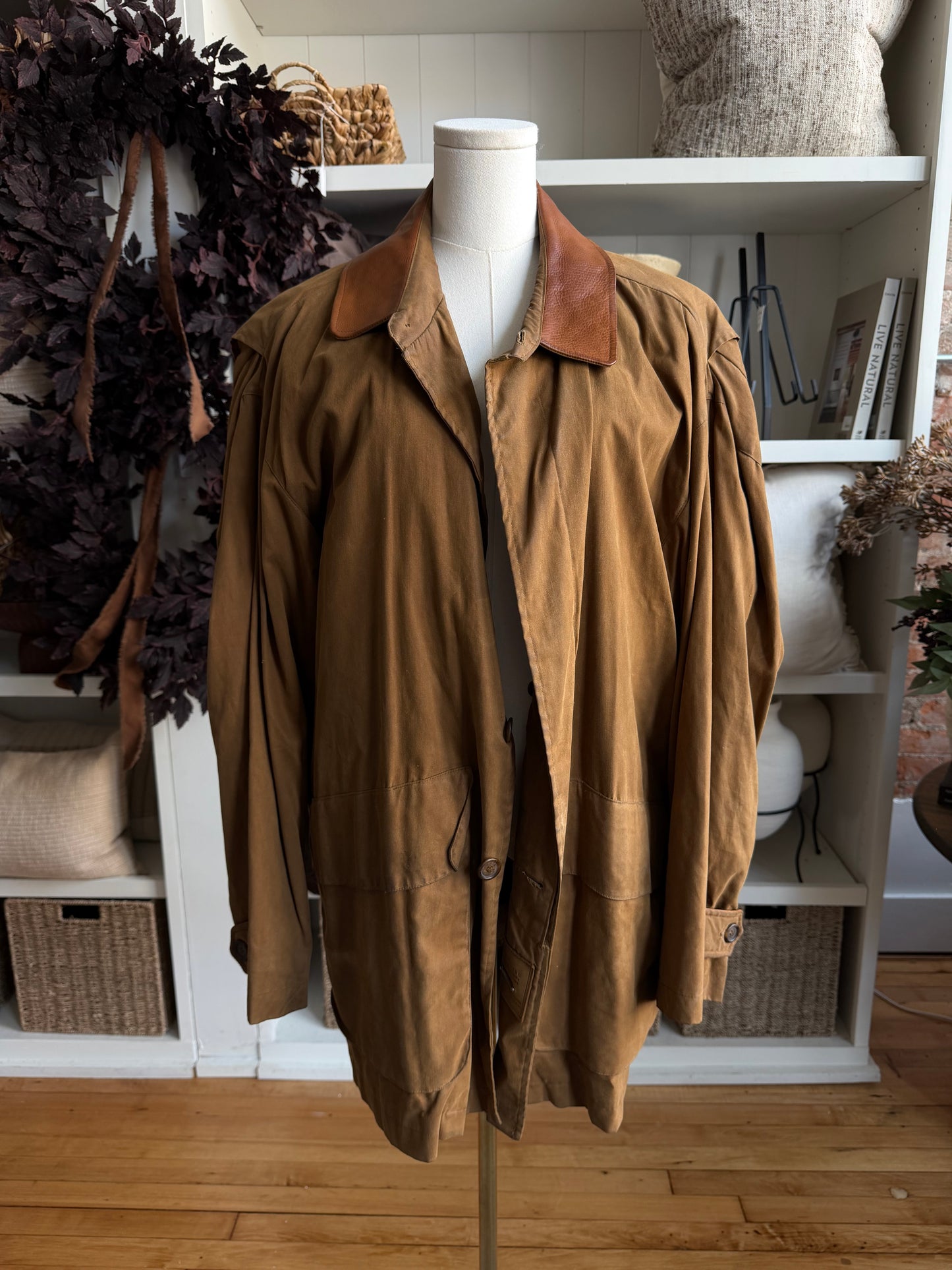 90s McKenzie Tribe waxed cotton jacket with leather collar and button out wool liner. Made in the USA. Fits M-XL