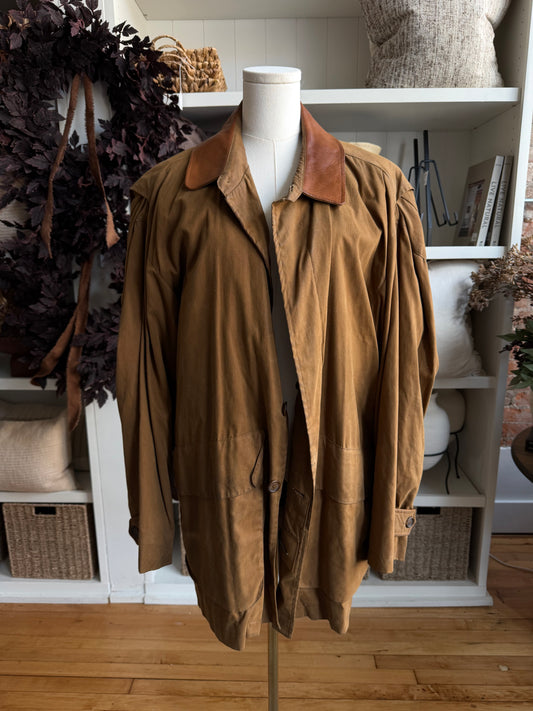 90s McKenzie Tribe waxed cotton jacket with leather collar and button out wool liner. Made in the USA. Fits M-XL